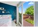 A private balcony is seen off the main bedroom, perfect for relaxing and enjoying the view of the backyard at 12545 Elm St, Thornton, CO 80241