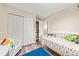 Bright bedroom with a closet, a reading nook, and a playful colorful aesthetic that will adore at 12545 Elm St, Thornton, CO 80241