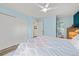 Bright main bedroom features a ceiling fan, a spacious closet, and an ensuite bathroom, perfect for comfortable living at 12545 Elm St, Thornton, CO 80241