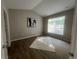 Bedroom with a large window, hardwood flooring, and vaulted ceilings at 14400 Albrook Dr # 88, Denver, CO 80239