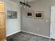 Dining room with a contemporary chandelier, decorative mirror, and natural light at 14400 Albrook Dr # 88, Denver, CO 80239