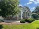 Charming single-story home with a well-maintained lawn, showcasing beautiful landscaping at 14400 Albrook Dr # 88, Denver, CO 80239