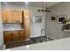 Bright kitchen featuring wood cabinets, countertops, and contemporary lighting at 14400 Albrook Dr # 88, Denver, CO 80239
