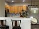 Kitchen featuring stainless steel appliances, breakfast bar and contemporary lighting at 14400 Albrook Dr # 88, Denver, CO 80239