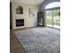 Cozy living room featuring a stone fireplace, ample natural light and neutral wall color at 14400 Albrook Dr # 88, Denver, CO 80239