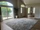 Bright, open living room with large windows, a neutral color palette, and hardwood floors, creating a serene and inviting space at 14400 Albrook Dr # 88, Denver, CO 80239