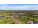 Aerial view of a community with a golf course, tennis courts, swimming pool and a clubhouse at 22873 E David Pl, Aurora, CO 80016