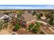 Aerial view of a two-story tan and brick home with mature landscaping at 22873 E David Pl, Aurora, CO 80016