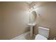 Powder room featuring pedestal sink, modern fixtures, and tile flooring creating a clean space at 22873 E David Pl, Aurora, CO 80016