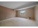 Spacious bedroom with neutral carpet, window, and closet provides a comfortable retreat at 22873 E David Pl, Aurora, CO 80016