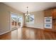 Bright dining area with wood floors, deck access, and natural light, perfect for entertaining at 22873 E David Pl, Aurora, CO 80016