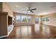 Bright and open living room boasting hardwood floors, large windows, and access to the backyard at 22873 E David Pl, Aurora, CO 80016