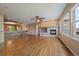 Open-concept living room with a fireplace, hardwood floors, and easy access to other living spaces at 22873 E David Pl, Aurora, CO 80016