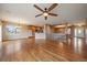 Expansive living space with hardwood floors, an open layout, and seamless flow to the kitchen at 22873 E David Pl, Aurora, CO 80016