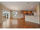 Hardwood floors throughout this combined Kitchen, Living, Dining Room space at 22873 E David Pl, Aurora, CO 80016