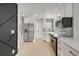 Contemporary kitchen with modern appliances, white cabinets, and sleek countertops at 4670 Josephine St, Denver, CO 80216