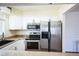 This kitchen features stainless steel appliances, granite countertops and updated cabinetry at 1250 S Monaco Pkwy # 44, Denver, CO 80224