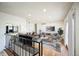 The open-concept living room features hardwood floors, recessed lighting, and a seamless flow to the kitchen at 1250 S Monaco Pkwy # 44, Denver, CO 80224