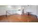 Hardwood floors grace the living room, adjoining a modern kitchen and dining area at 1250 S Monaco Pkwy # 44, Denver, CO 80224