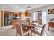 Eat-in kitchen with stainless steel appliances and an island at 708 Brome Pl, Lafayette, CO 80026