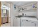 Bright laundry room with washer, dryer, and ample storage at 708 Brome Pl, Lafayette, CO 80026