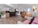 Bright living room featuring hardwood floors and built-in shelving at 708 Brome Pl, Lafayette, CO 80026