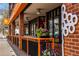 Charming Tangerine building exterior featuring outdoor dining space with floral arrangements at 708 Brome Pl, Lafayette, CO 80026