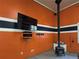 Garage with wood stove, TV, and painted walls at 34989 Forest Park Dr, Elizabeth, CO 80107