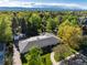Serene single-story home surrounded by mature trees with mountain views at 3925 S Cherry St, Englewood, CO 80113