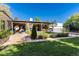 Spacious backyard showcasing a lush lawn, outdoor seating and landscaped garden at 3925 S Cherry St, Englewood, CO 80113
