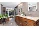 This bathroom has dual sinks, granite countertops and large windows at 3925 S Cherry St, Englewood, CO 80113