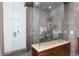 The bathroom features a walk in shower, a rain shower head and tile walls at 3925 S Cherry St, Englewood, CO 80113
