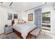This bedroom features natural light and a bed at 3925 S Cherry St, Englewood, CO 80113