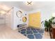Bright entryway with hardwood floors, area rug, and stylish decor at 3925 S Cherry St, Englewood, CO 80113