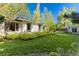 Exterior shot showcasing a home's well-manicured lawn with window views at 3925 S Cherry St, Englewood, CO 80113
