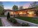 Lush backyard showcasing expansive patio with various seating areas and manicured lawn at 3925 S Cherry St, Englewood, CO 80113