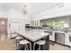 Modern kitchen with stainless steel appliances, an island with bar seating, and plenty of storage space at 3925 S Cherry St, Englewood, CO 80113