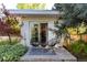 Covered patio with modern chairs and views of greenery at 3925 S Cherry St, Englewood, CO 80113