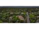 Estate home with mature trees, lush lawns, and beautiful landscaping at 6616 E Prentice Ave, Greenwood Village, CO 80111