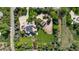 Aerial view of a large estate featuring lush landscaping and a circular driveway at 6616 E Prentice Ave, Greenwood Village, CO 80111