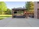 Backyard patio area with a covered gazebo, outdoor seating, and a view of the landscaped yard at 6616 E Prentice Ave, Greenwood Village, CO 80111
