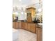 Elegant bathroom with dual sinks, granite countertops, decorative lighting, and a fireplace at 6616 E Prentice Ave, Greenwood Village, CO 80111