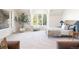 Bright bedroom with a large window and a leafy tree in a pot, creating a serene space at 6616 E Prentice Ave, Greenwood Village, CO 80111