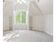 A bright, airy room featuring a window and shelving, casting sunlight on the flooring at 6616 E Prentice Ave, Greenwood Village, CO 80111