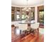 Bright breakfast nook with bay windows and hardwood floors at 6616 E Prentice Ave, Greenwood Village, CO 80111