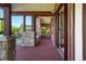A covered outdoor patio with stone and brick accents featuring a scenic backyard view at 6616 E Prentice Ave, Greenwood Village, CO 80111