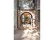 Grand entryway showcasing an arched doorway with view to a luxury chandelier and staircase at 6616 E Prentice Ave, Greenwood Village, CO 80111