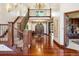Impressive foyer features grand staircase, elegant chandelier, and gleaming hardwood floors at 6616 E Prentice Ave, Greenwood Village, CO 80111