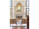 Living room showcasing a stone fireplace with decorative mirror at 6616 E Prentice Ave, Greenwood Village, CO 80111