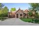 Charming brick home with a beautiful garden, attached garage and inviting curb appeal at 6616 E Prentice Ave, Greenwood Village, CO 80111